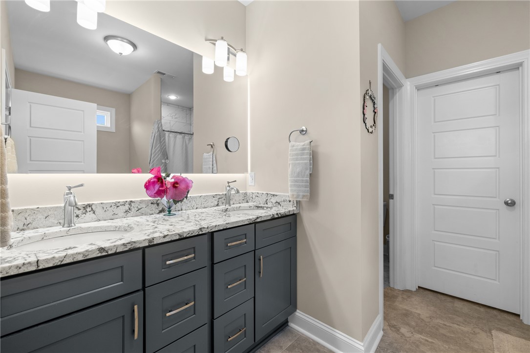 422 Mountain View Church Road Six Mile, SC 29682 - Photo 22 of 40 Dual vanities with granite counters provide ample space in this well-appointed primary bathroom.