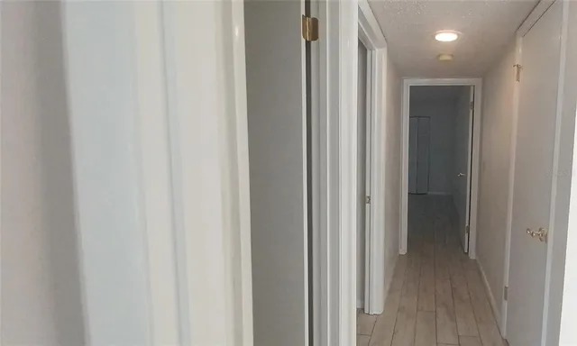 a view of hallway with stainless steel appliances