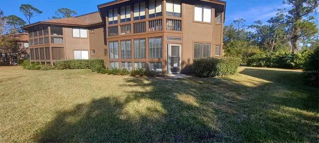 a view of a building with a yard