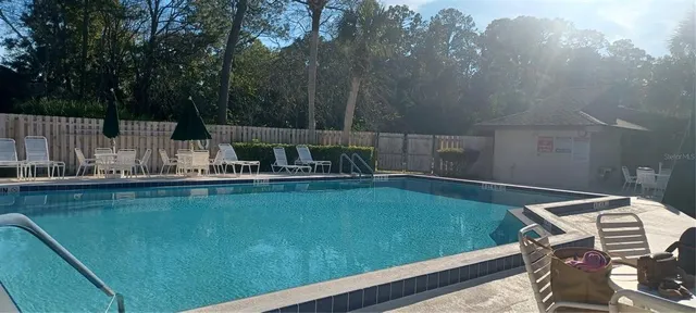 a view of a swimming pool with a patio