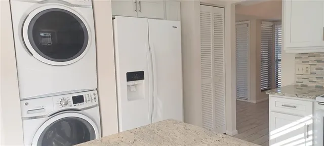 a view of a hallway with washer and dryer
