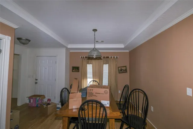 a view of a dining room with furniture window and outside view