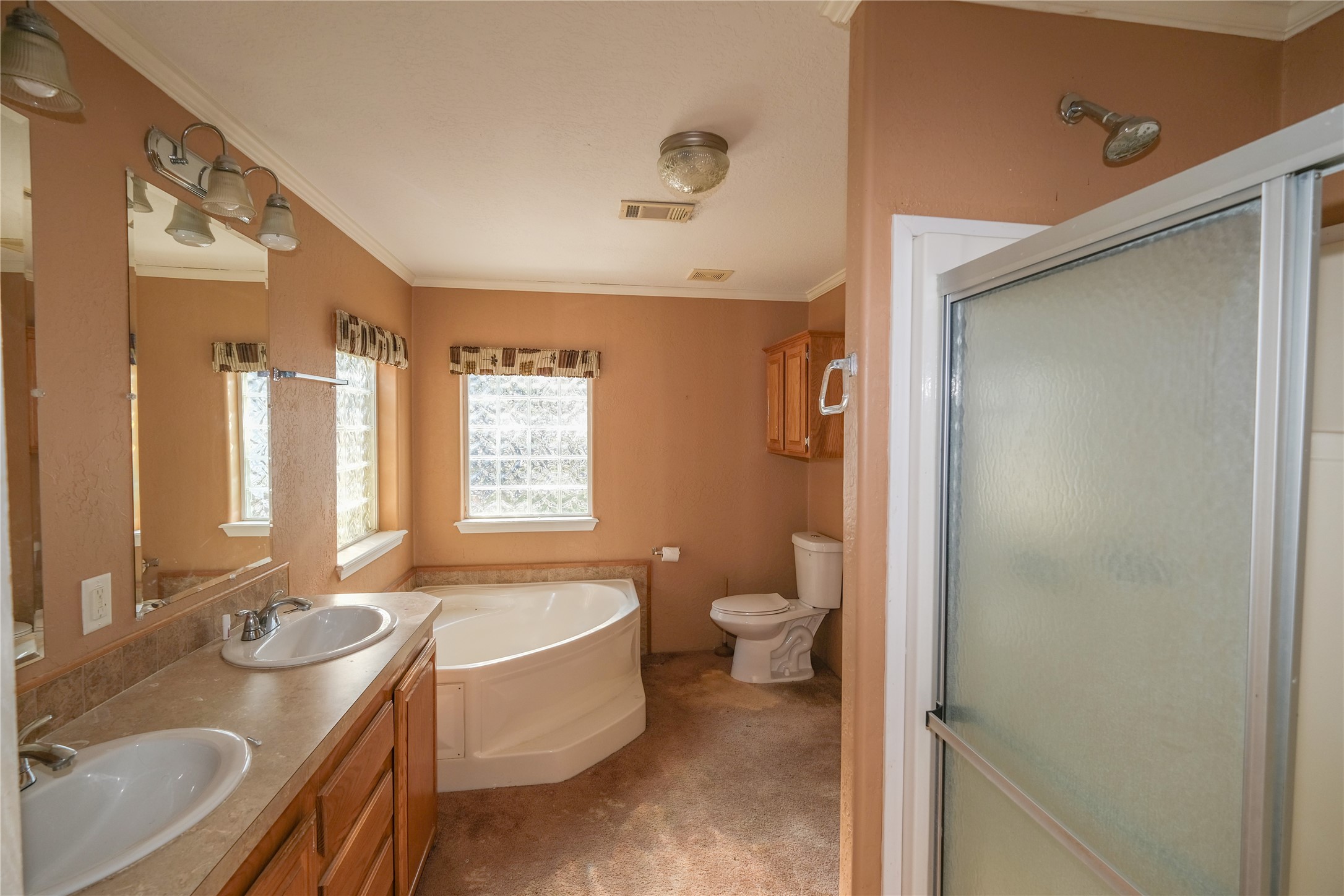 174 W Creek Trinity, TX 75862 - Photo 20 of 49 a bathroom with a granite countertop sink toilet and shower