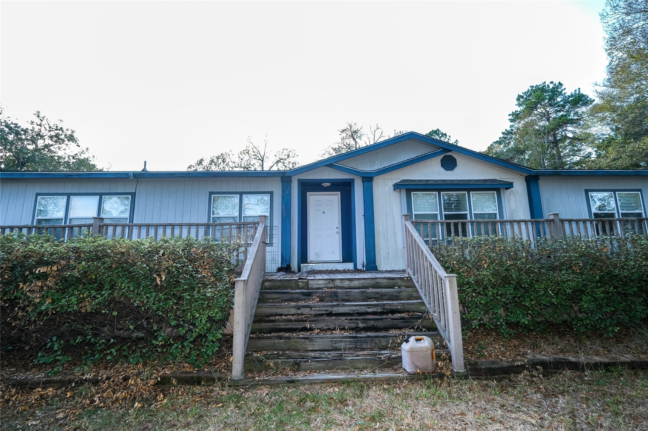174 W Creek Trinity, TX 75862 - Photo 2 of 49 a front view of a house with a yard