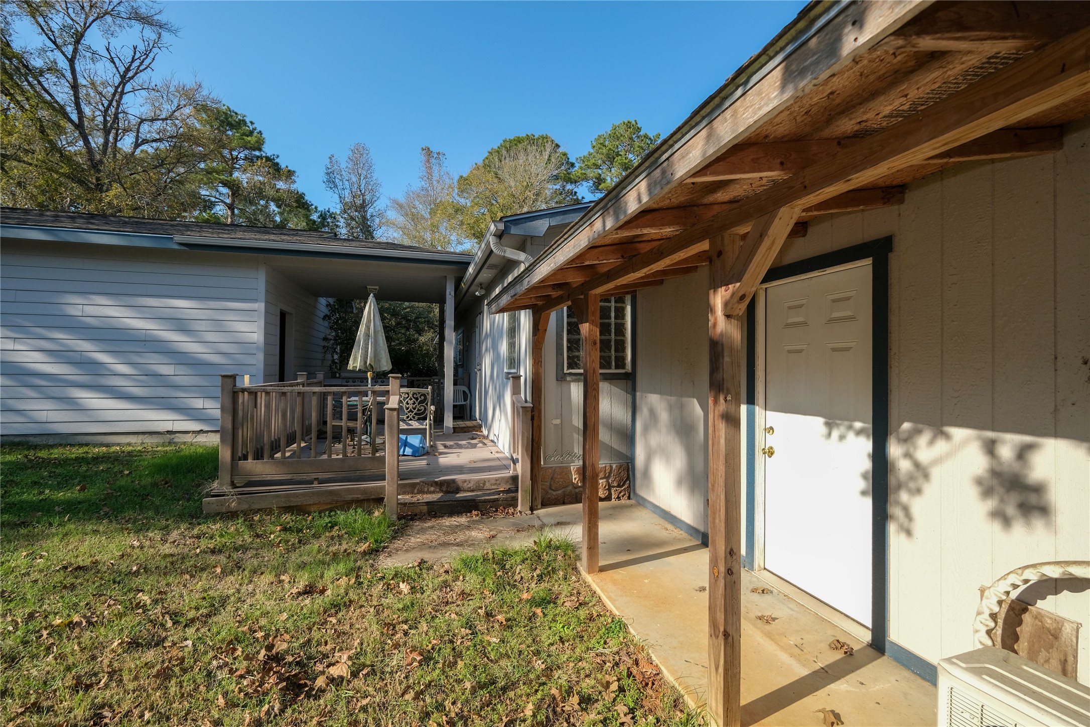 174 W Creek Trinity, TX 75862 - Photo 42 of 49 a view of a porch with furniture and floor to ceiling window