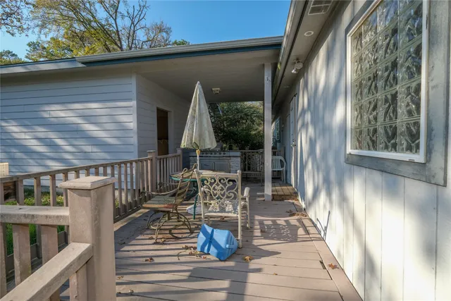 a view of balcony with wooden floor