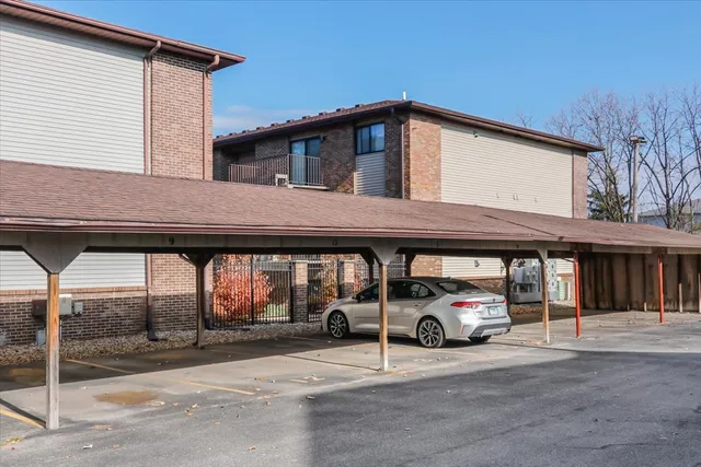 a car parked in front of white house