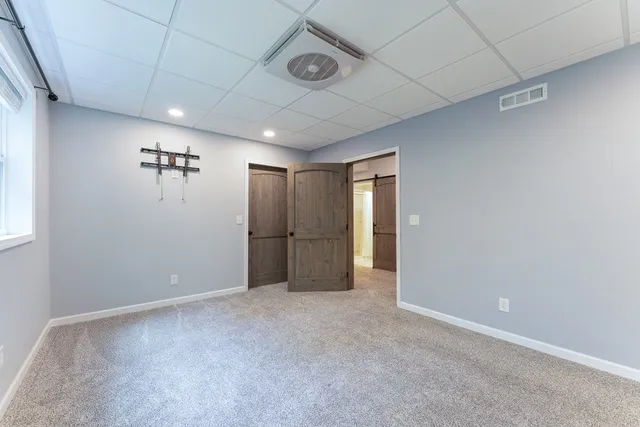 a balcony with wooden floor and outdoor space