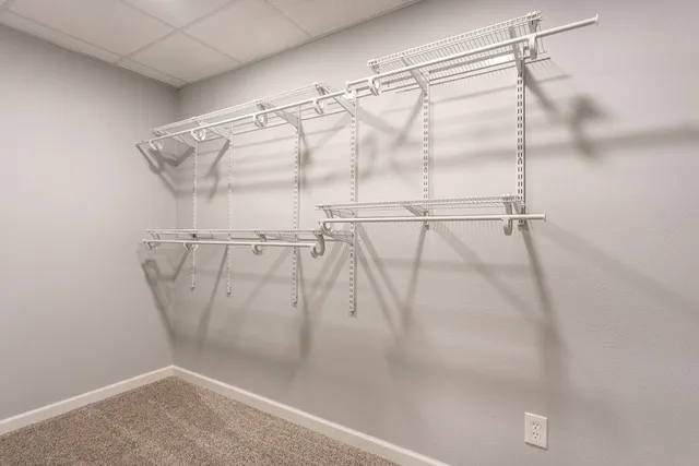 a balcony with wooden floor and outdoor seating