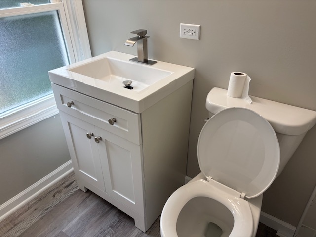 456 Franklin Boulevard Elgin, IL 60120 - Photo 18 of 32 a white toilet sitting next to a bathroom sink