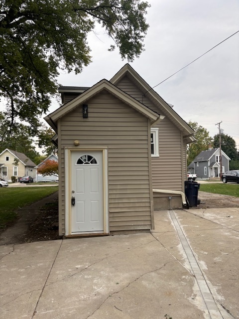 456 Franklin Boulevard Elgin, IL 60120 - Photo 25 of 32 a view of a house with a yard and garage