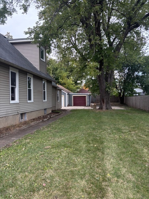456 Franklin Boulevard Elgin, IL 60120 - Photo 29 of 32 a view of a yard in front of a house with large tree