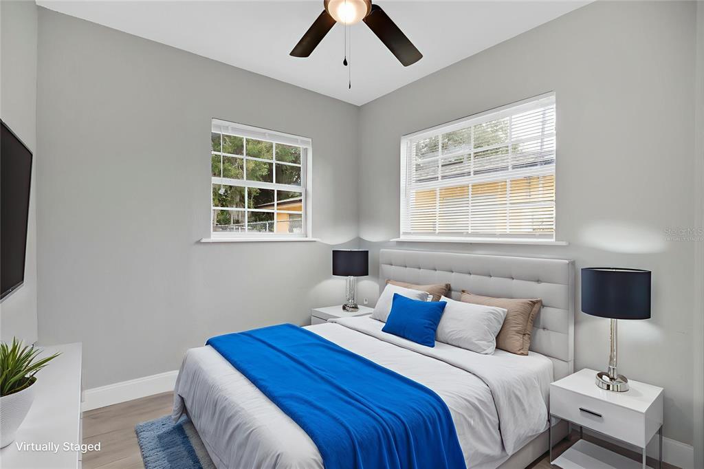 911 Indiana Street Orlando, FL 32805 - Photo 12 of 24 a bedroom with a bed and a window