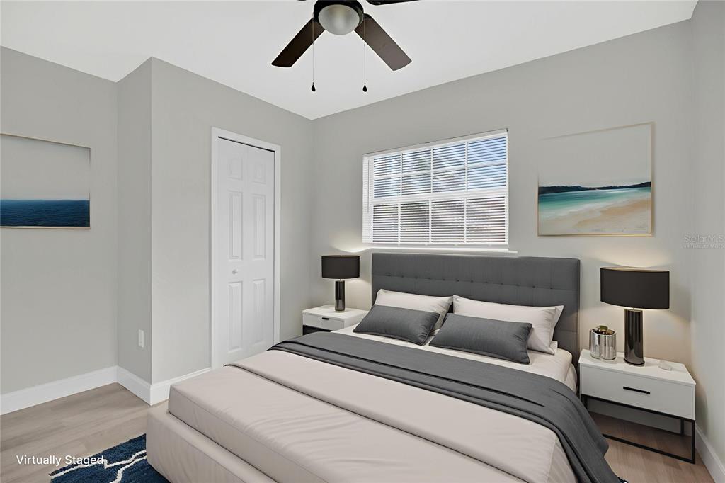 911 Indiana Street Orlando, FL 32805 - Photo 13 of 24 a bedroom with a bed and a window