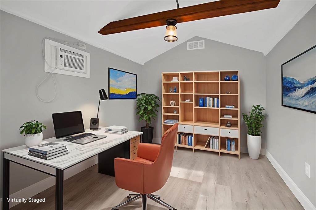 911 Indiana Street Orlando, FL 32805 - Photo 16 of 24 a view of a workspace with furniture and a workspace