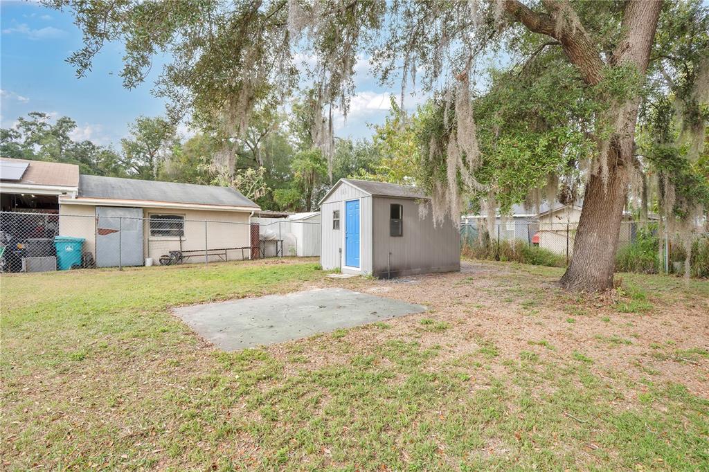 911 Indiana Street Orlando, FL 32805 - Photo 17 of 24 a view of a house with backyard and tree
