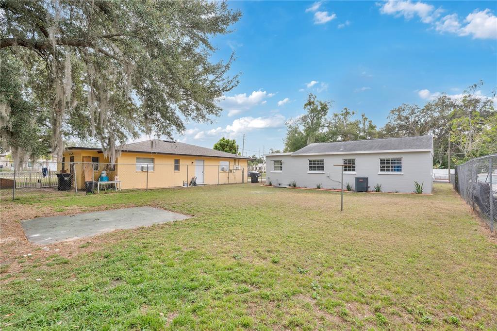 911 Indiana Street Orlando, FL 32805 - Photo 18 of 24 a front view of a house with a yard and trees