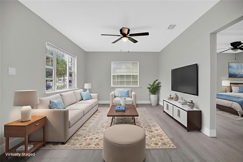 911 Indiana Street Orlando, FL 32805 - Photo 5 of 24 a living room with furniture and a flat screen tv