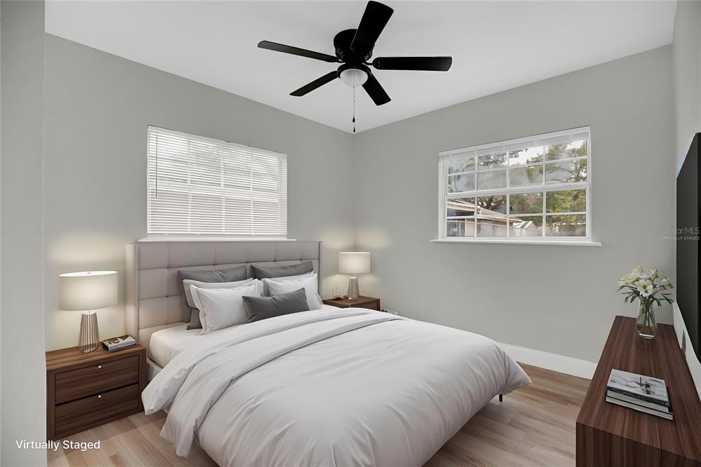 911 Indiana Street Orlando, FL 32805 - Photo 9 of 24 a bedroom with a bed and a window