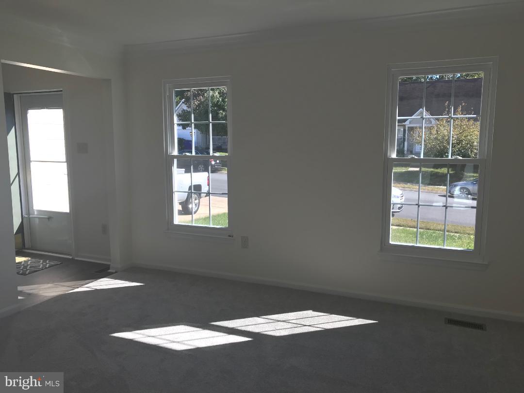 1008 Mariner Road Joppa, MD 21085 - Photo 10 of 26 Living room with crown molding, new carpet