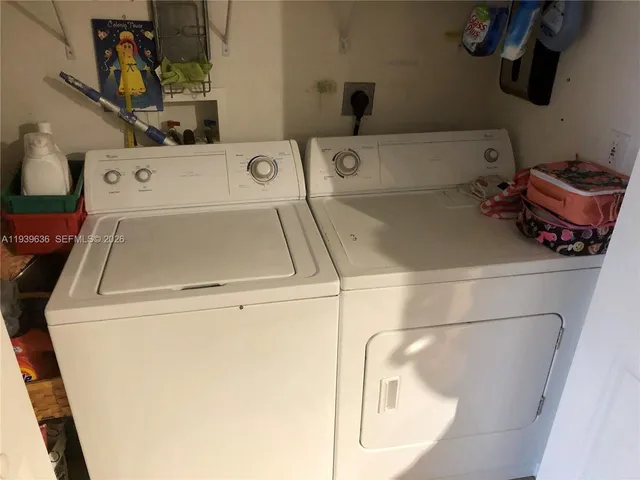 a utility room with dryer and washer