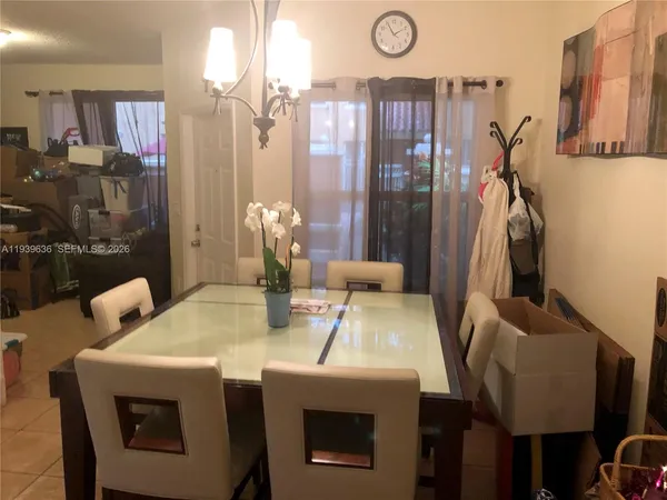 a view of dinning table and chairs