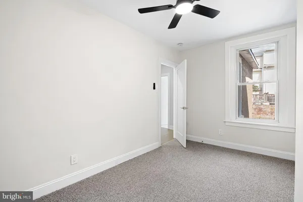 a view of an empty room with a window