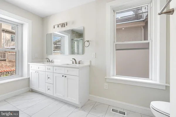 a bathroom with a tub and a sink