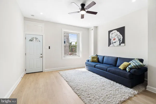 a living room with furniture and window