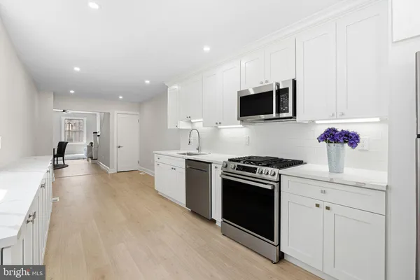 a view of a kitchen with a sink