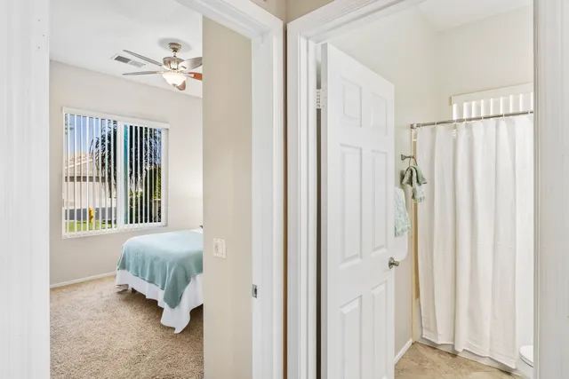 a view of swimming pool with outdoor seating and a lots of flower plants