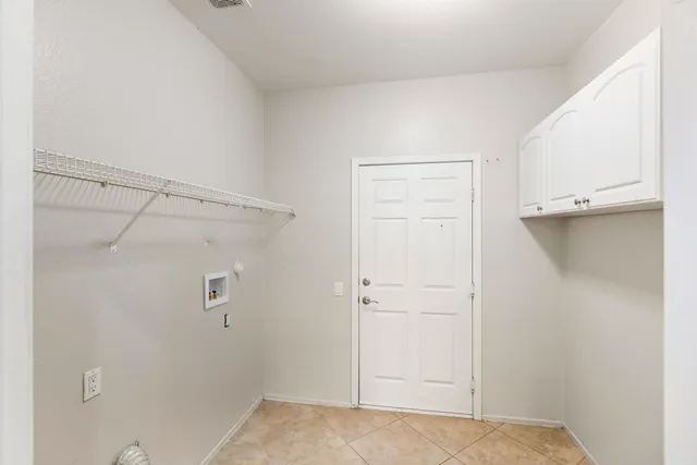 a view of a room with lots of gym equipment