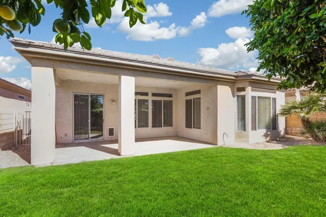 a very nice looking living room with furniture and a large window