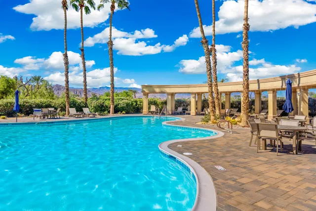 a view of an outdoor space with furniture and garden