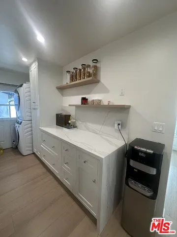 a kitchen with cabinets and stove
