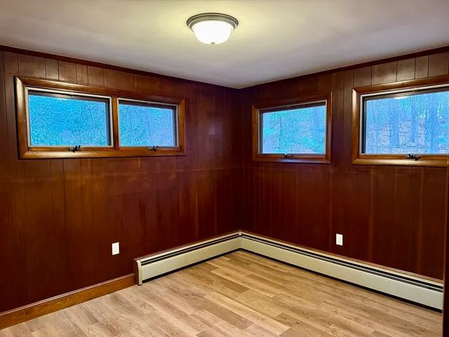 a view of an empty room with windows