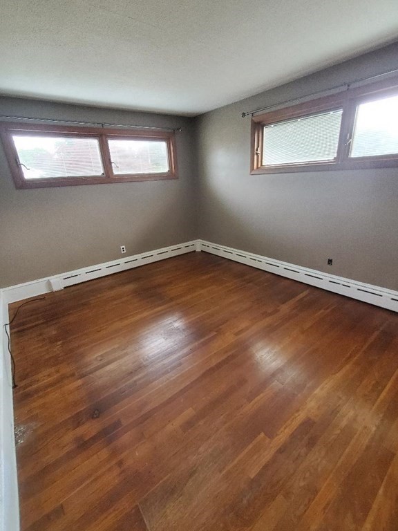 107 Davis Road Westport, MA 02790 - Photo 11 of 26 a view of a room with wooden floor and window