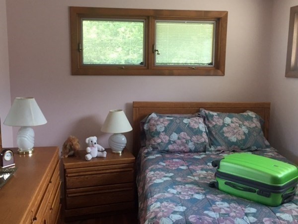 107 Davis Road Westport, MA 02790 - Photo 16 of 26 a bedroom with a bed and a window