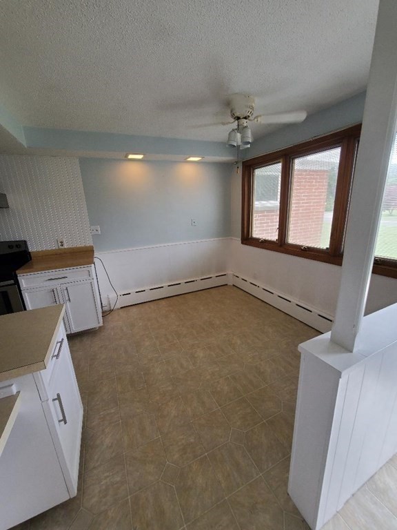 107 Davis Road Westport, MA 02790 - Photo 3 of 26 wooden floor in an empty room with a window