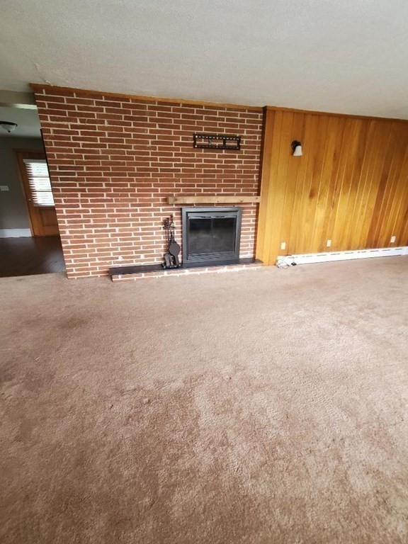 107 Davis Road Westport, MA 02790 - Photo 9 of 26 a view of empty room with a fireplace