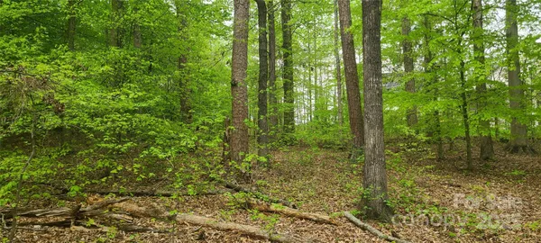 front view of a brick house with a yard