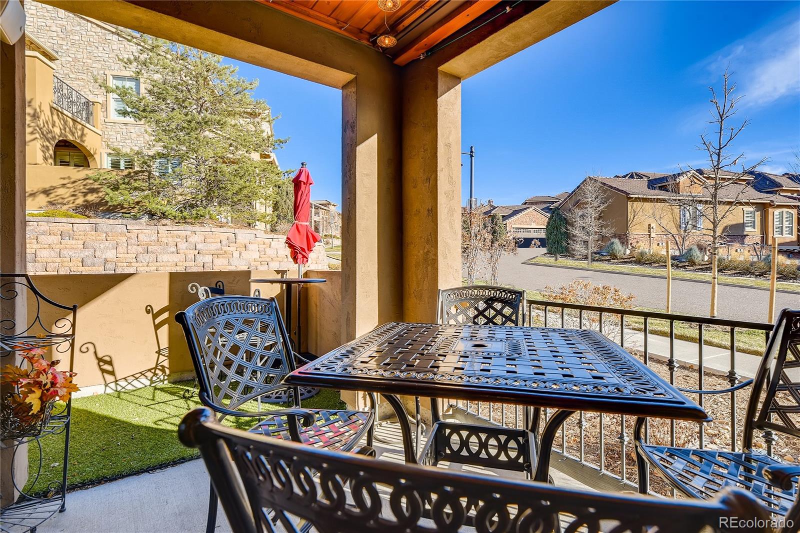 9198 Viaggio Way Highlands Ranch, CO 80126 - Photo 14 of 37 a view of a chairs and table in the patio