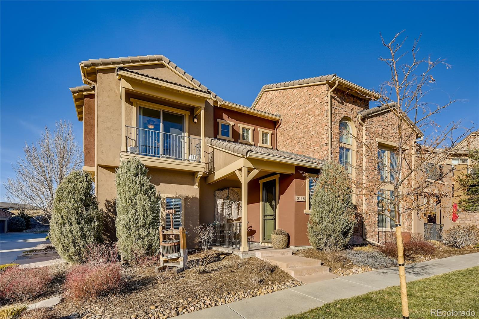 9198 Viaggio Way Highlands Ranch, CO 80126 - Photo 2 of 37 a front view of a house