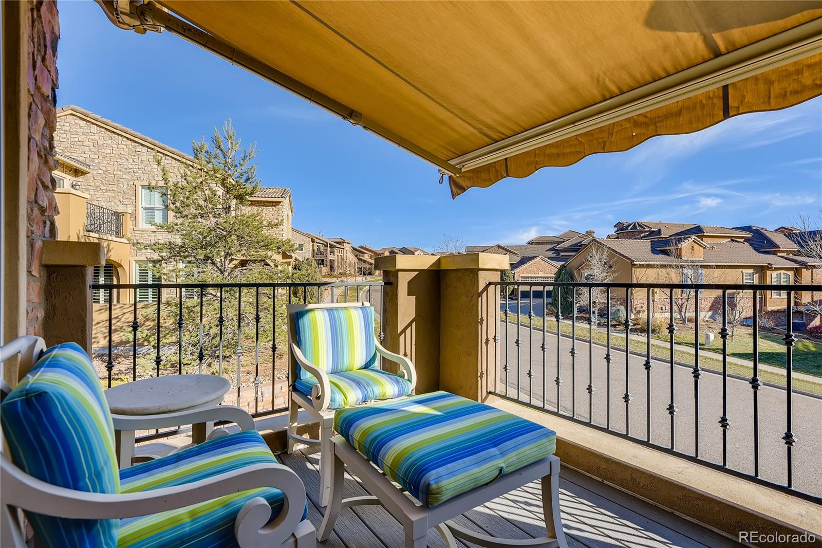 9198 Viaggio Way Highlands Ranch, CO 80126 - Photo 21 of 37 a view of a chairs and table in the patio