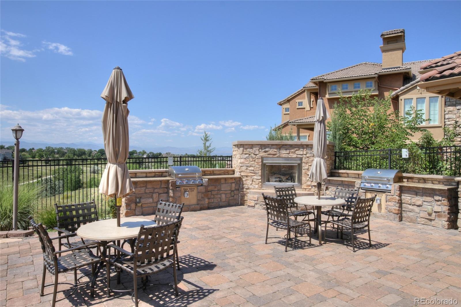 9198 Viaggio Way Highlands Ranch, CO 80126 - Photo 32 of 37 a view of a patio with a table and chairs