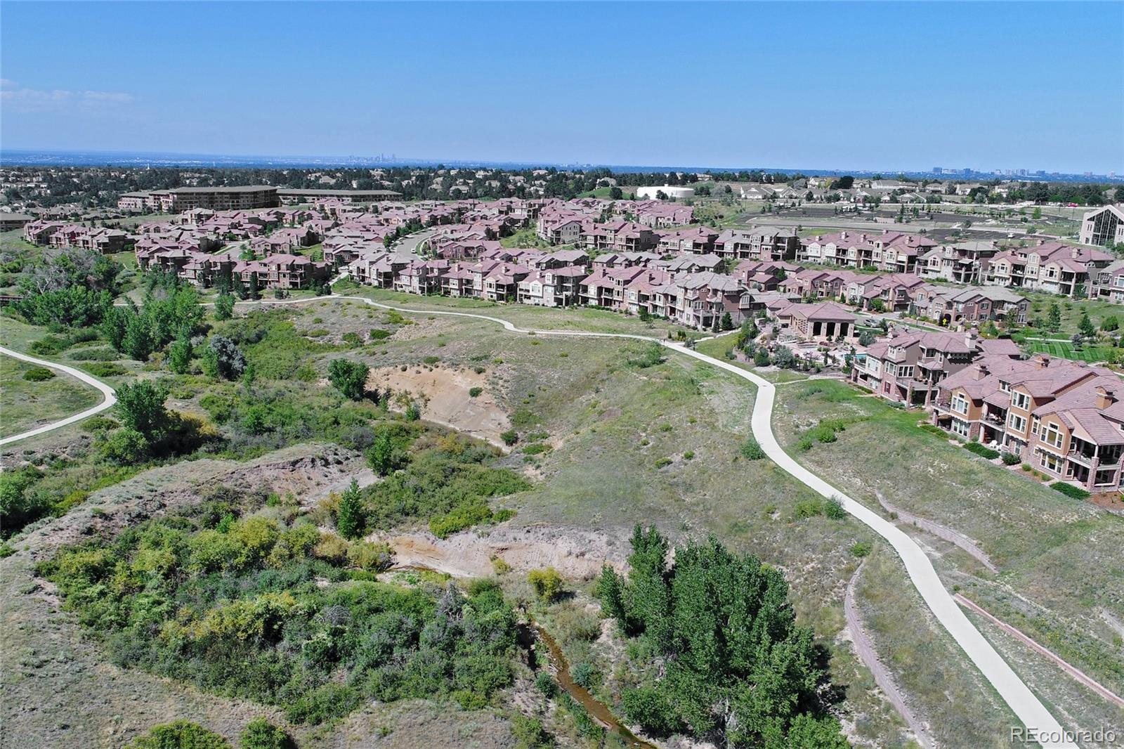 9198 Viaggio Way Highlands Ranch, CO 80126 - Photo 36 of 37 an aerial view of a house with a yard
