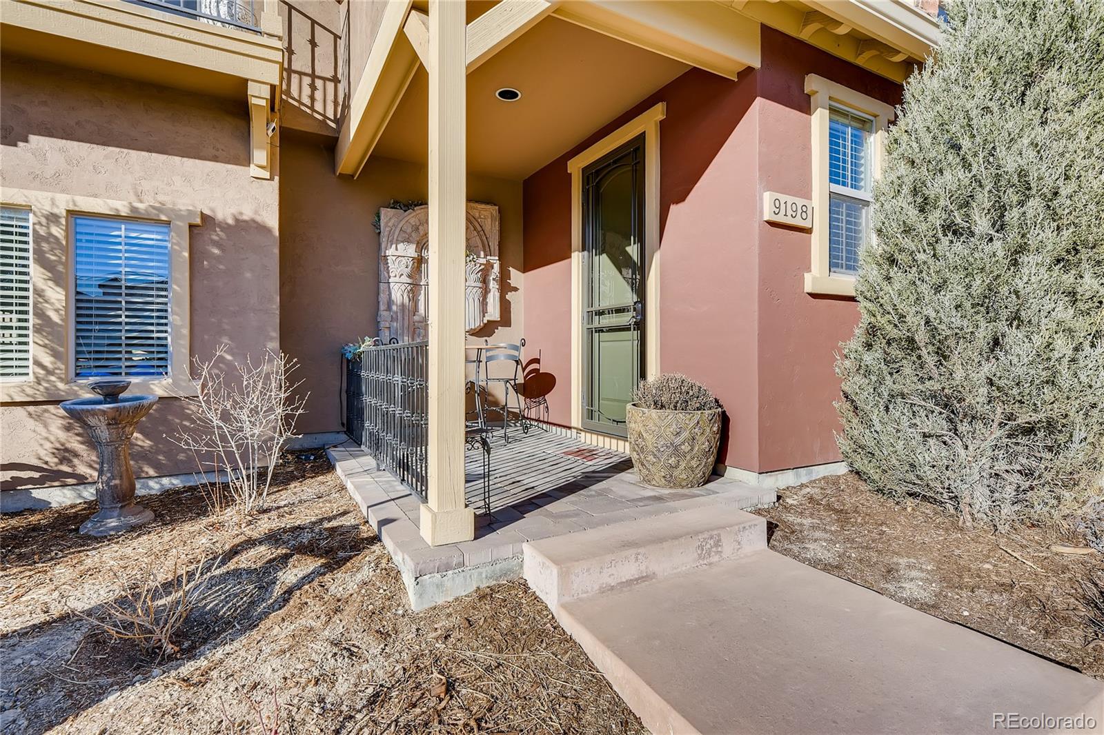 9198 Viaggio Way Highlands Ranch, CO 80126 - Photo 4 of 37 a view of a house with wooden fence