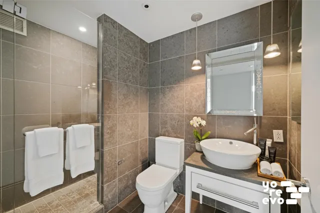 a bedroom with a bed and a couch