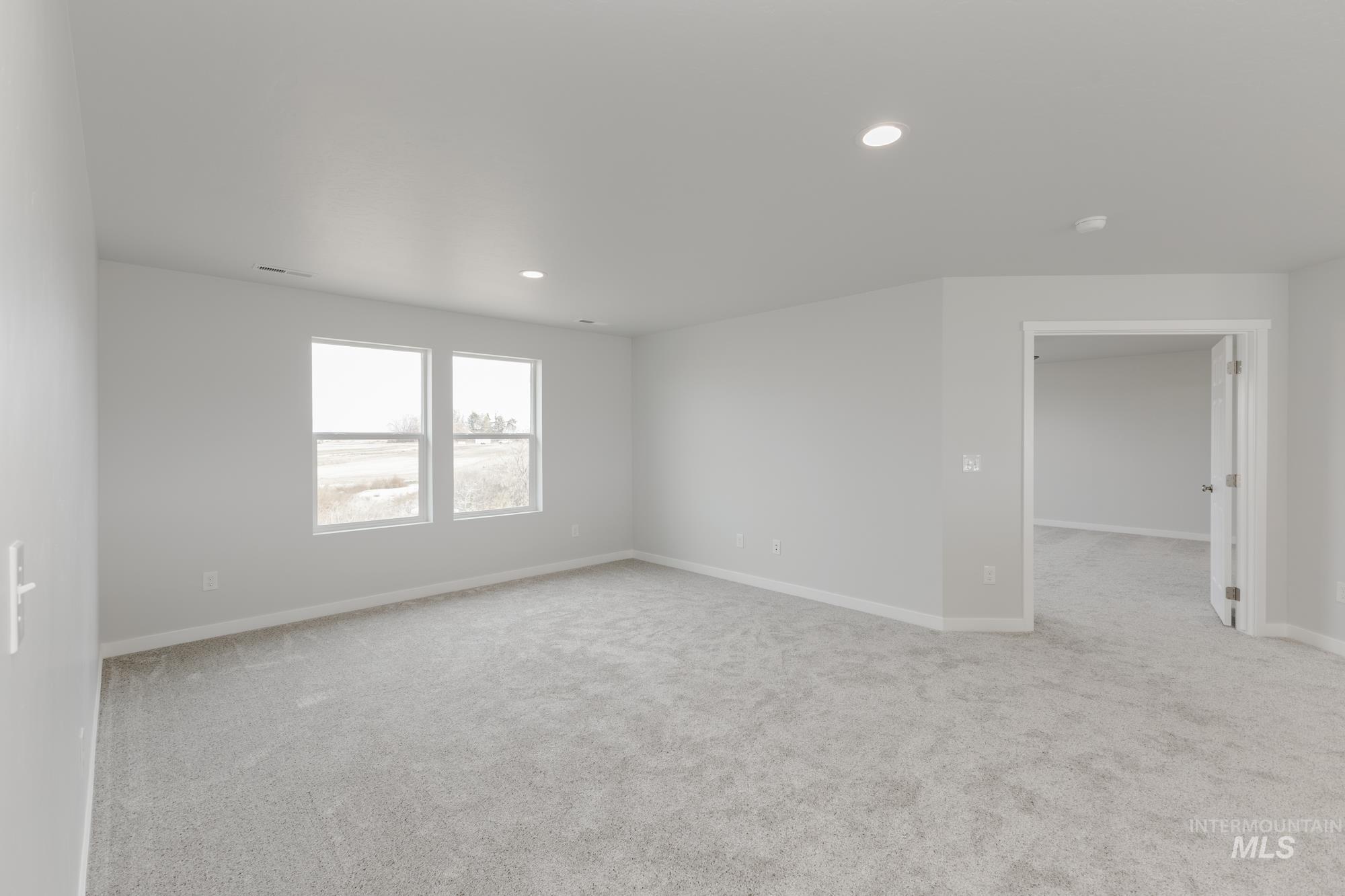 13683 Higley Court Caldwell, ID 83607 - Photo 21 of 31 Spare room with light colored carpet and recessed lighting