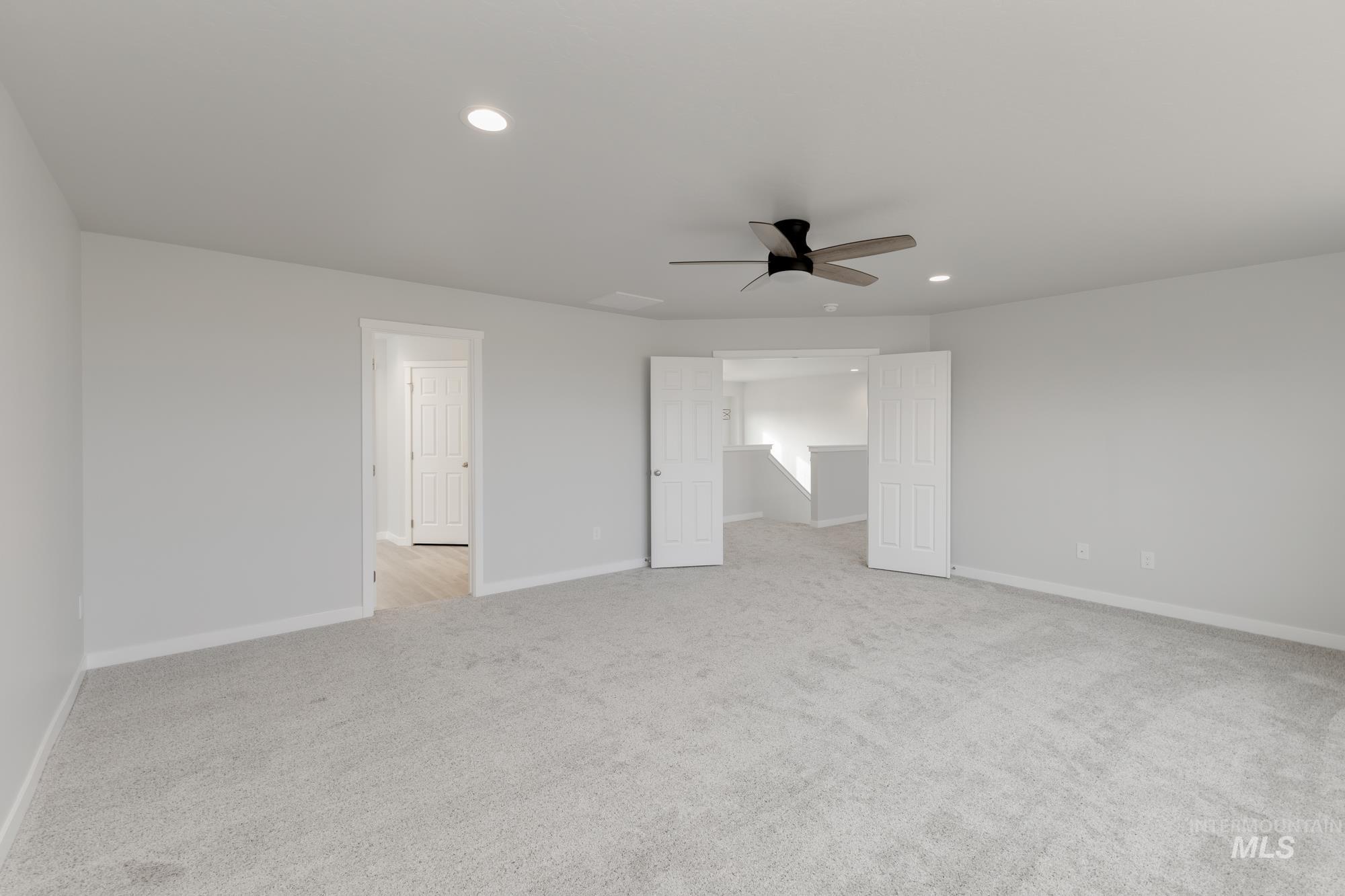 13683 Higley Court Caldwell, ID 83607 - Photo 27 of 31 Unfurnished room featuring recessed lighting, light carpet, and ceiling fan